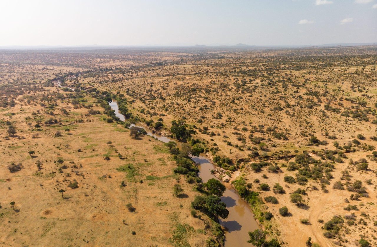 A high angle shot of a muddy river going through the desert captured in Samburu, Kenya